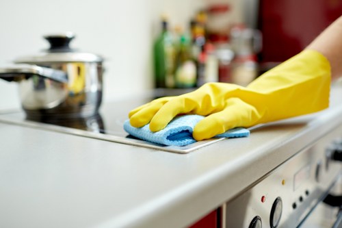 Local cleaning technician treating a stubborn spill in a central London home