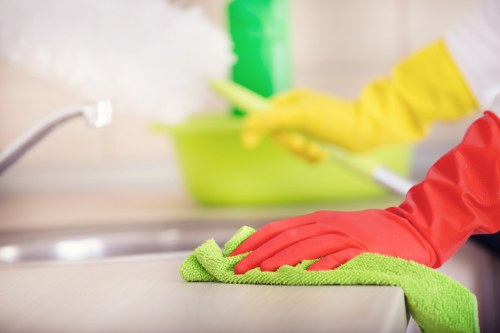 Professional cleaner working on central London office windows in W1G